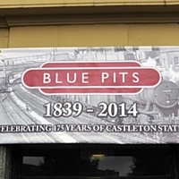 The commemorative banner over the roof to the Blue Pits pub.  T Young